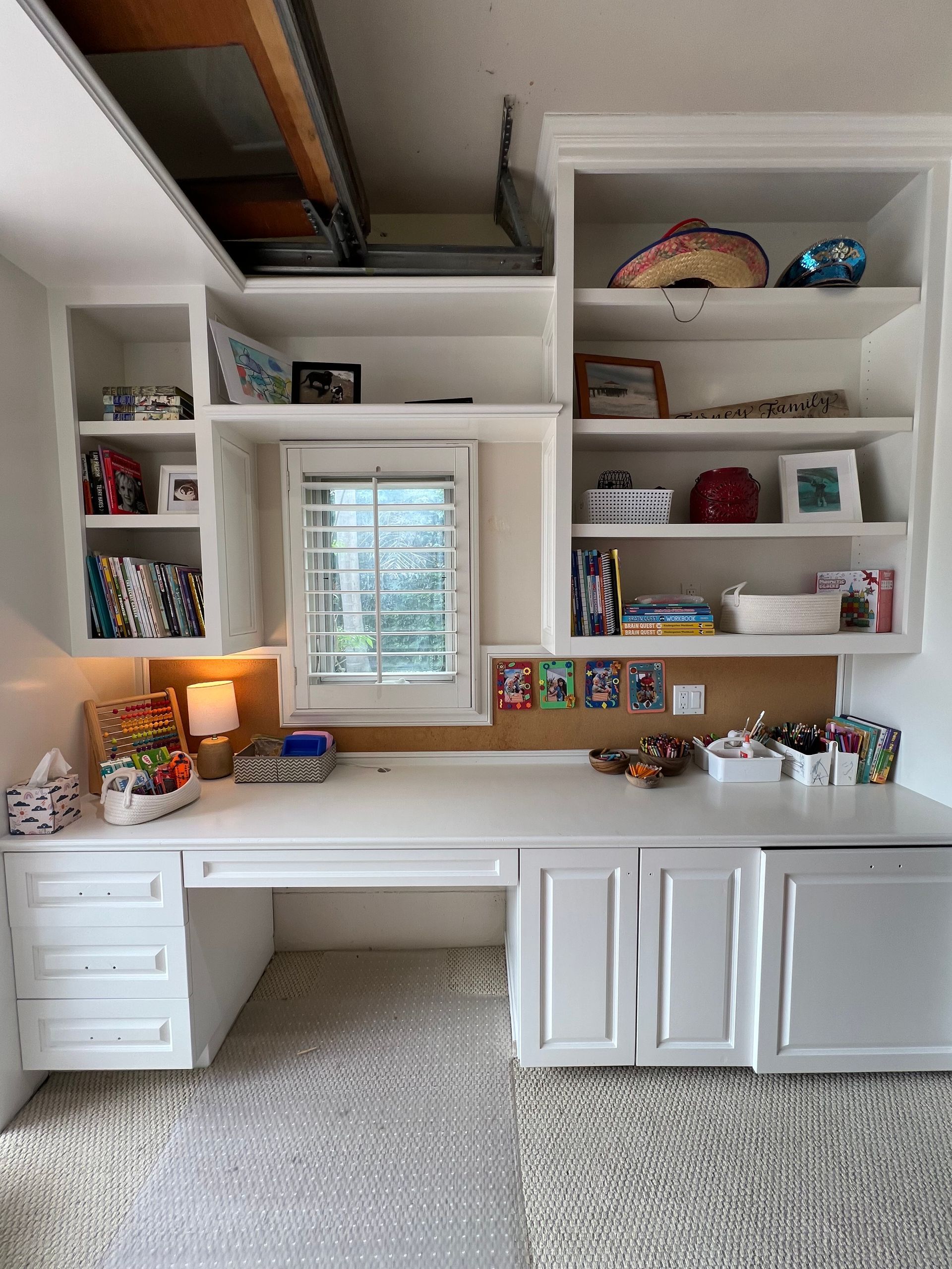 Organized kids study desk with bookshelves and supplies