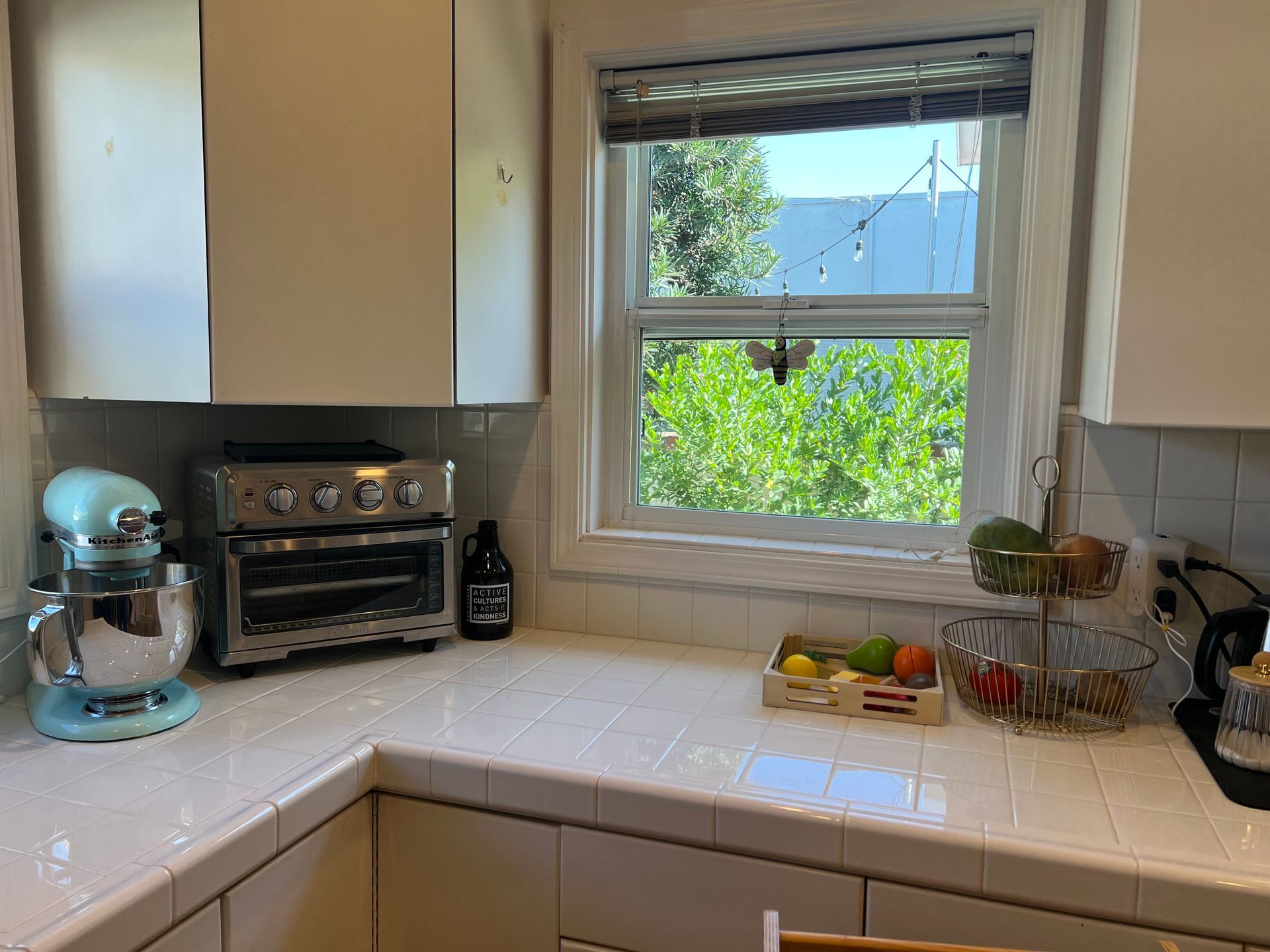 Clean kitchen counter with KitchenAid mixer and organized space